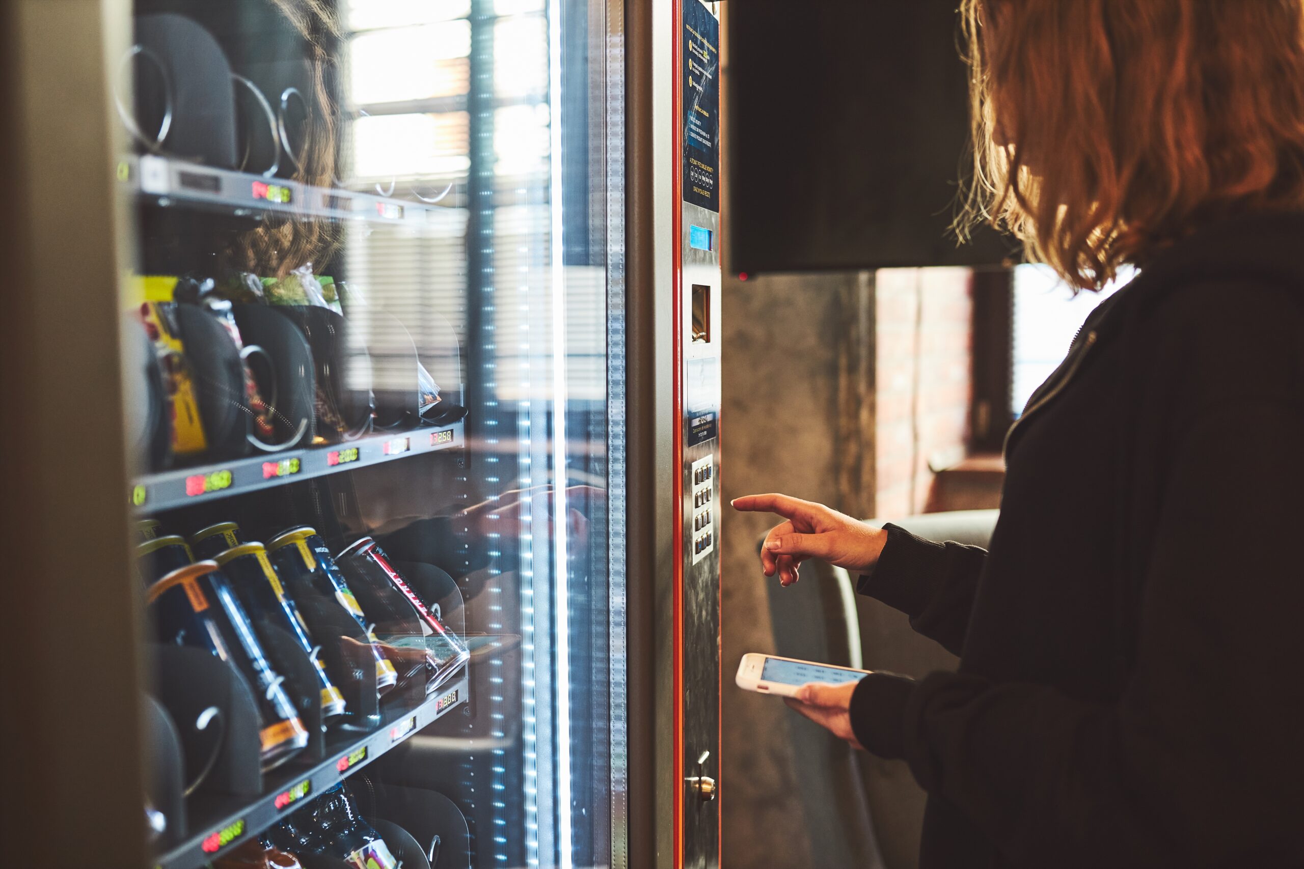 Glass-front snack and combo vending machine installed in a Twin Cities break room